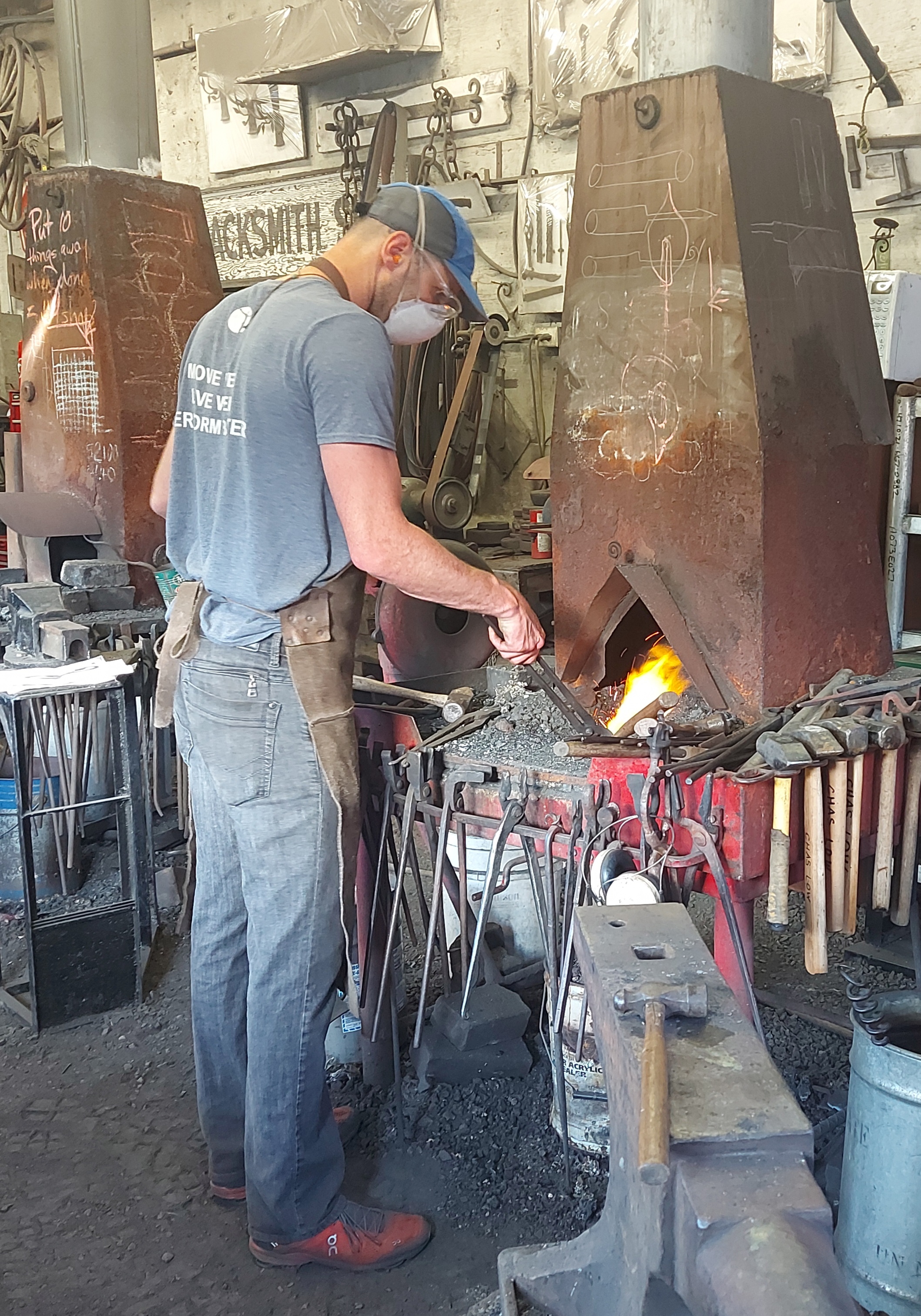 Blacksmith at work at a forge